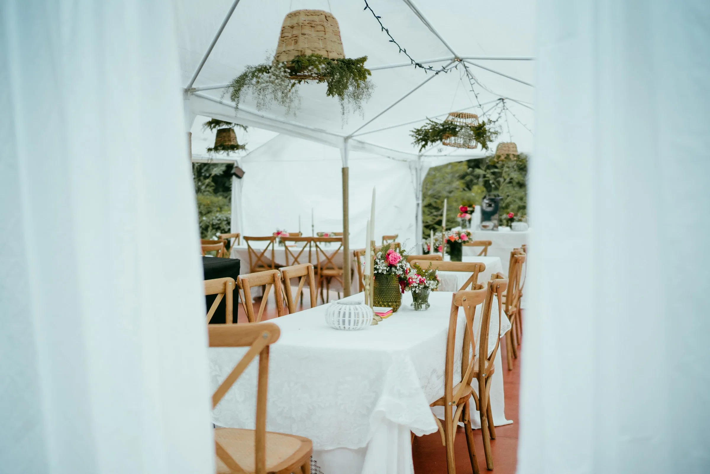 A styled wedding table inside a draped Tarpo tent